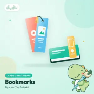 Stack of full-colour printed bookmarks with a tassel through a punch hole and a page-clip bookmark on a book