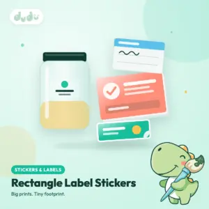 Rectangle label stickers in coral, mint and white beside a glass jar with a clear label, one sticker peeling at the corner